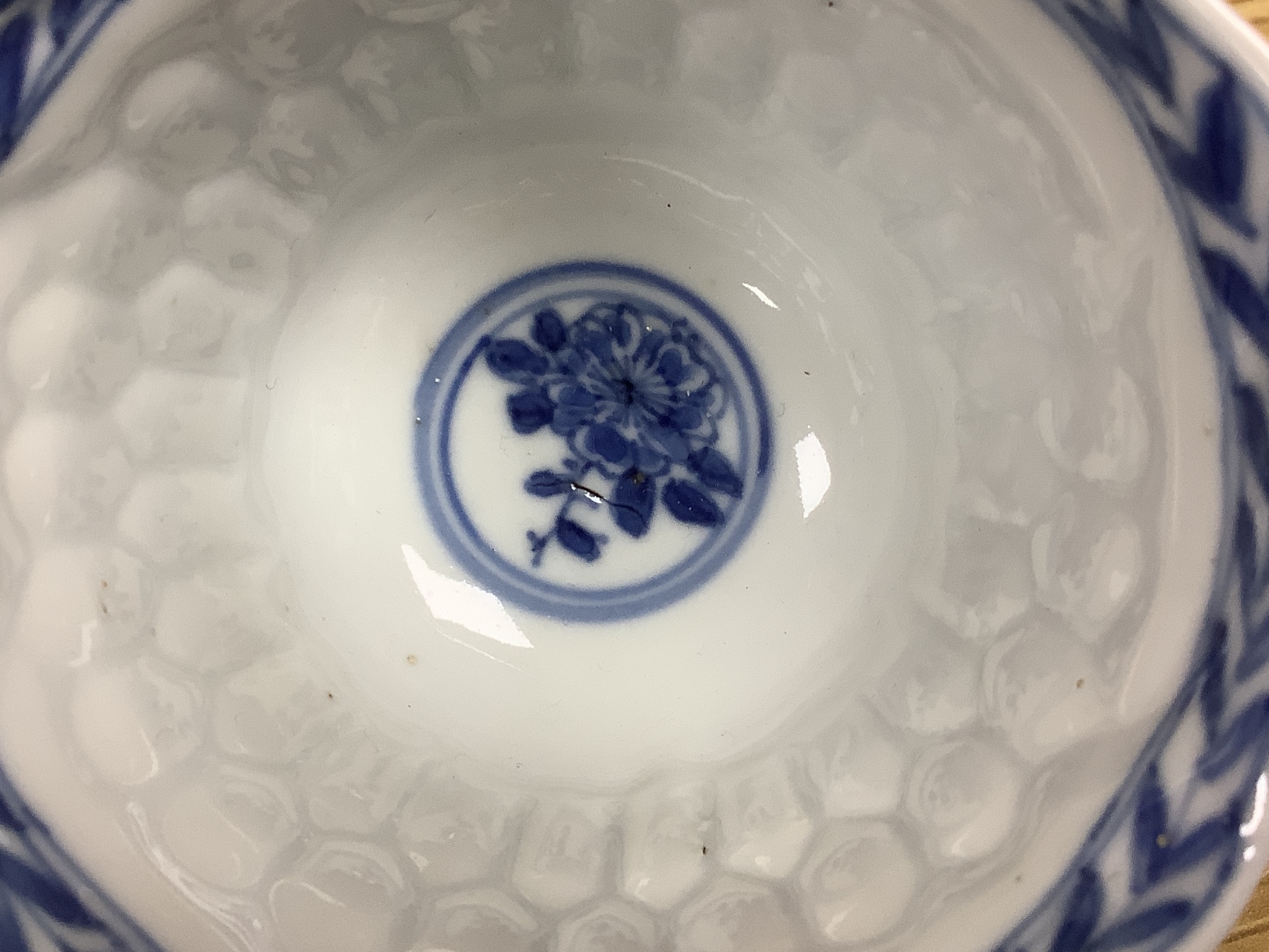 A Chinese blue and white plate 13cm diameter, a similar tea bowl and saucer, Kangxi period and a 19th century Chinese blue and white bottle vase